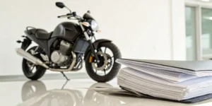 A motorcycle and the documents needed to get an insurance quote.
