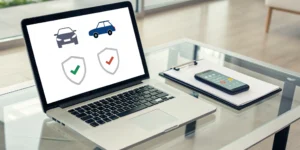A laptop screen with a tool to compare vehicle insurance rates and find savings.