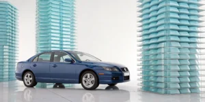 A car on a stack of blocks showing the added protection of stacked uninsured motorist coverage.
